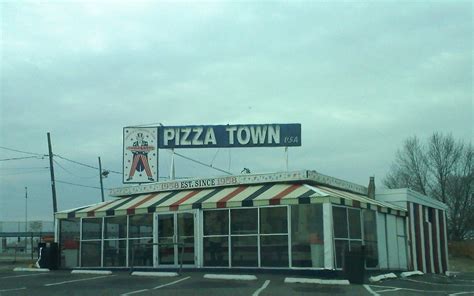 Pizza town usa - 1:26. When the owners of Pizza Town USA announced that they had sold the 64-year-old fabled joint in Elmwood Park, the news hit fans, to steal a line from an ancient love song, …